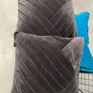 2 Grey Velvet and One teal pillow from Crate and Barrel